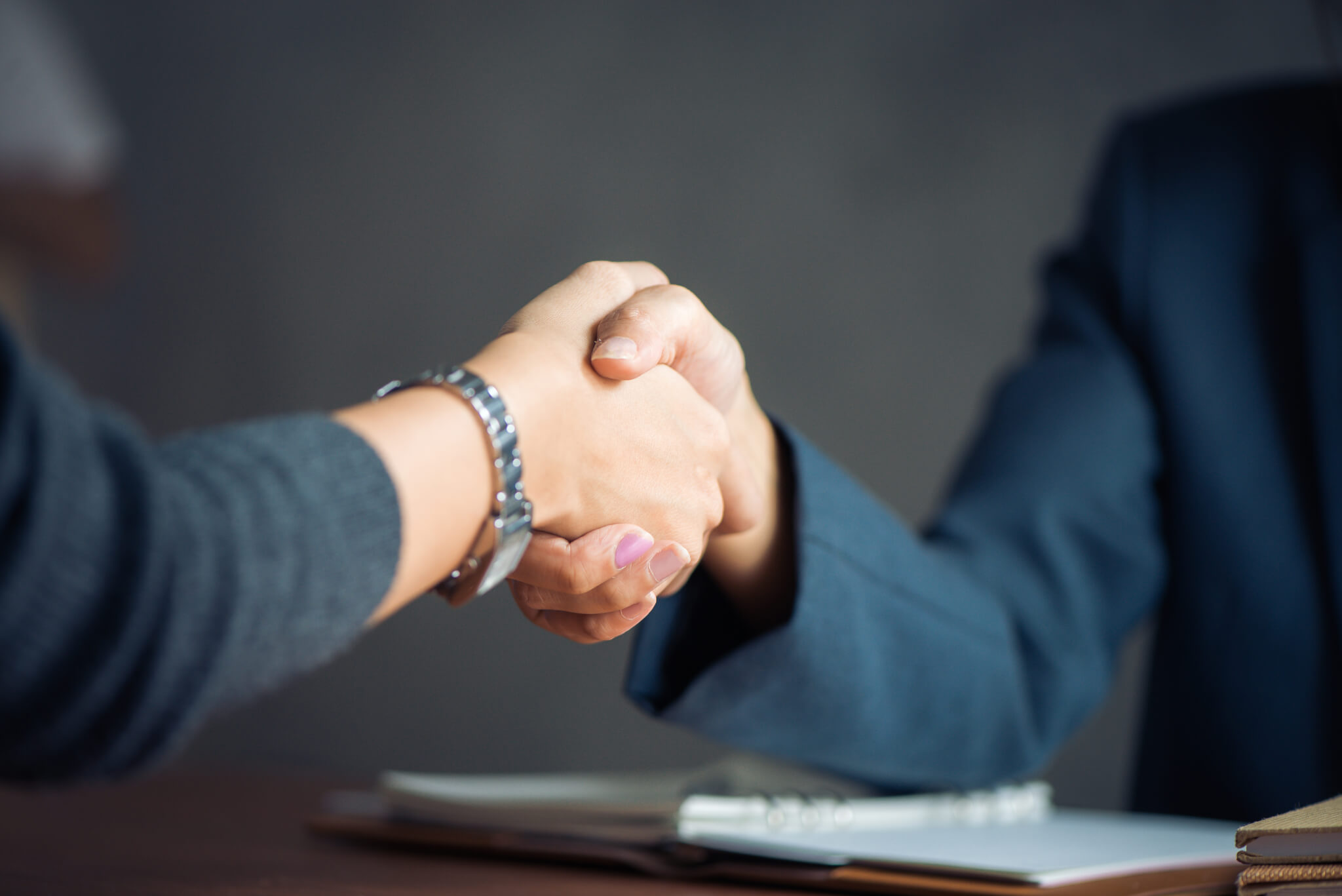 Negotiating business,Image businesswomen handshake,happy with wo
