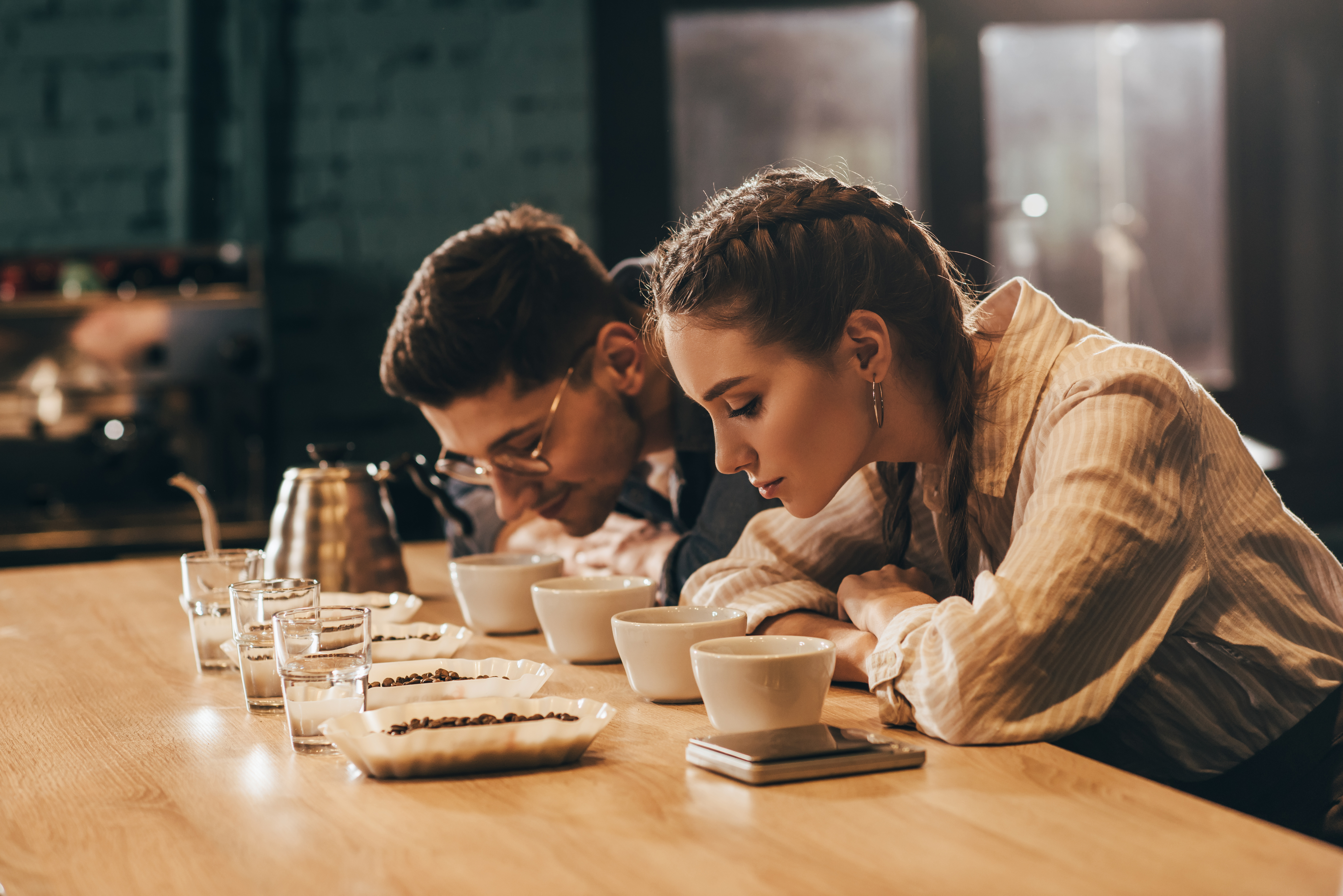 coffee shop workers checking coffee quality