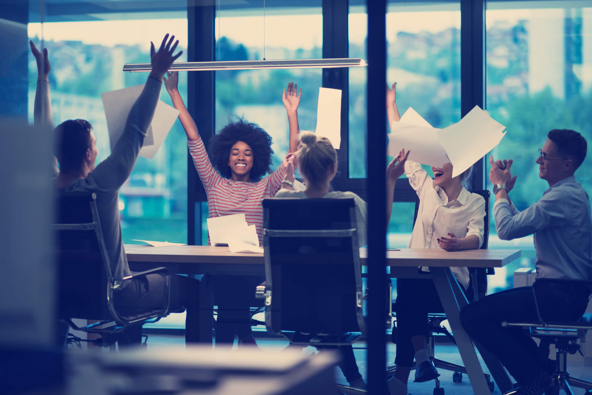 multiethnic Group of young business people throwing documents